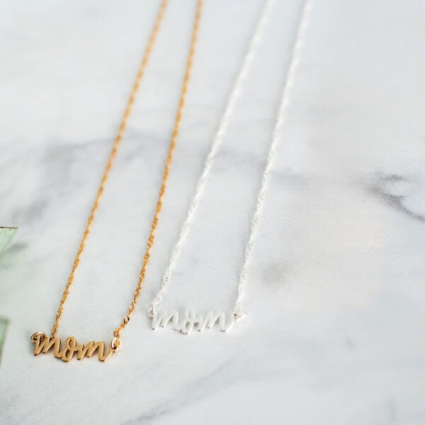 "Mom" brass necklace in gold and silver colors